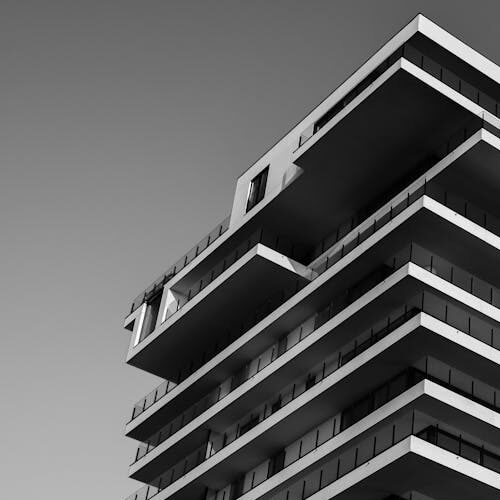 pexels-photo-157811-157811 A striking black and white photo of a modern high-rise building with unique geometric designs.